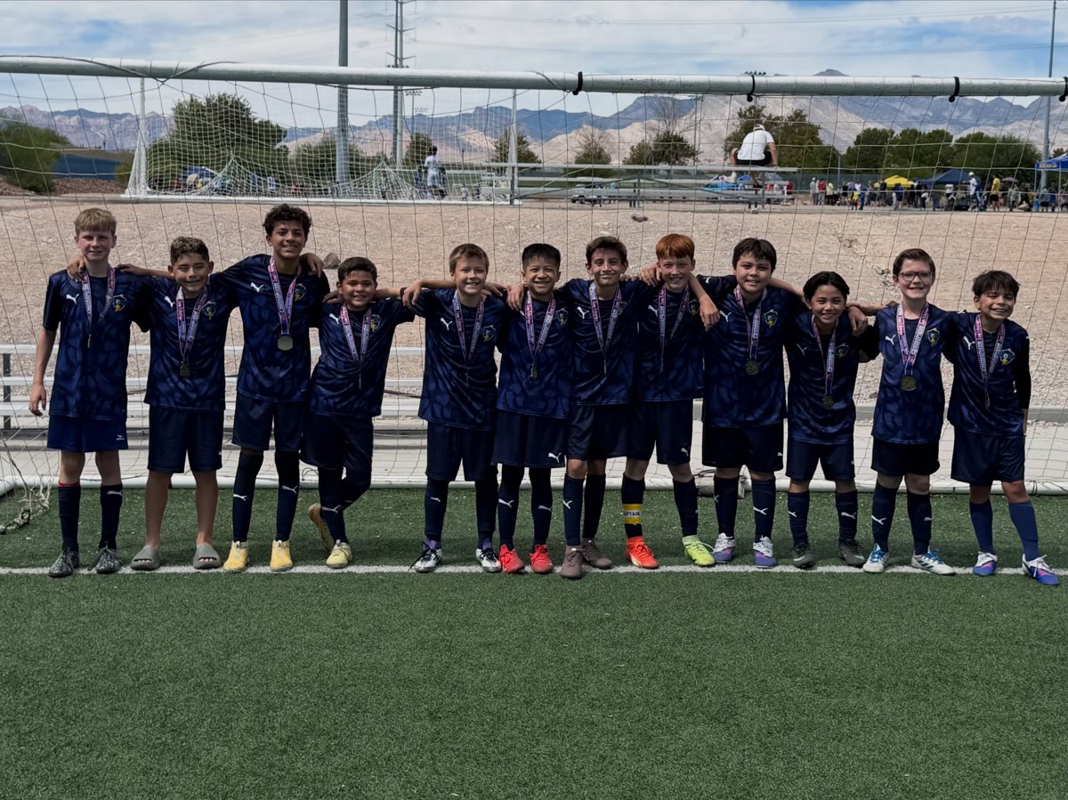BU12 Academy boys with champion medals