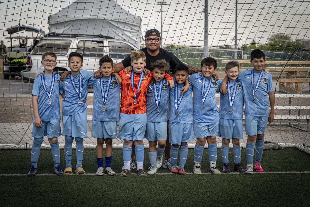 LV Storm FC Boys 2016 team with medals and coach at the Jeff Bush Tournament