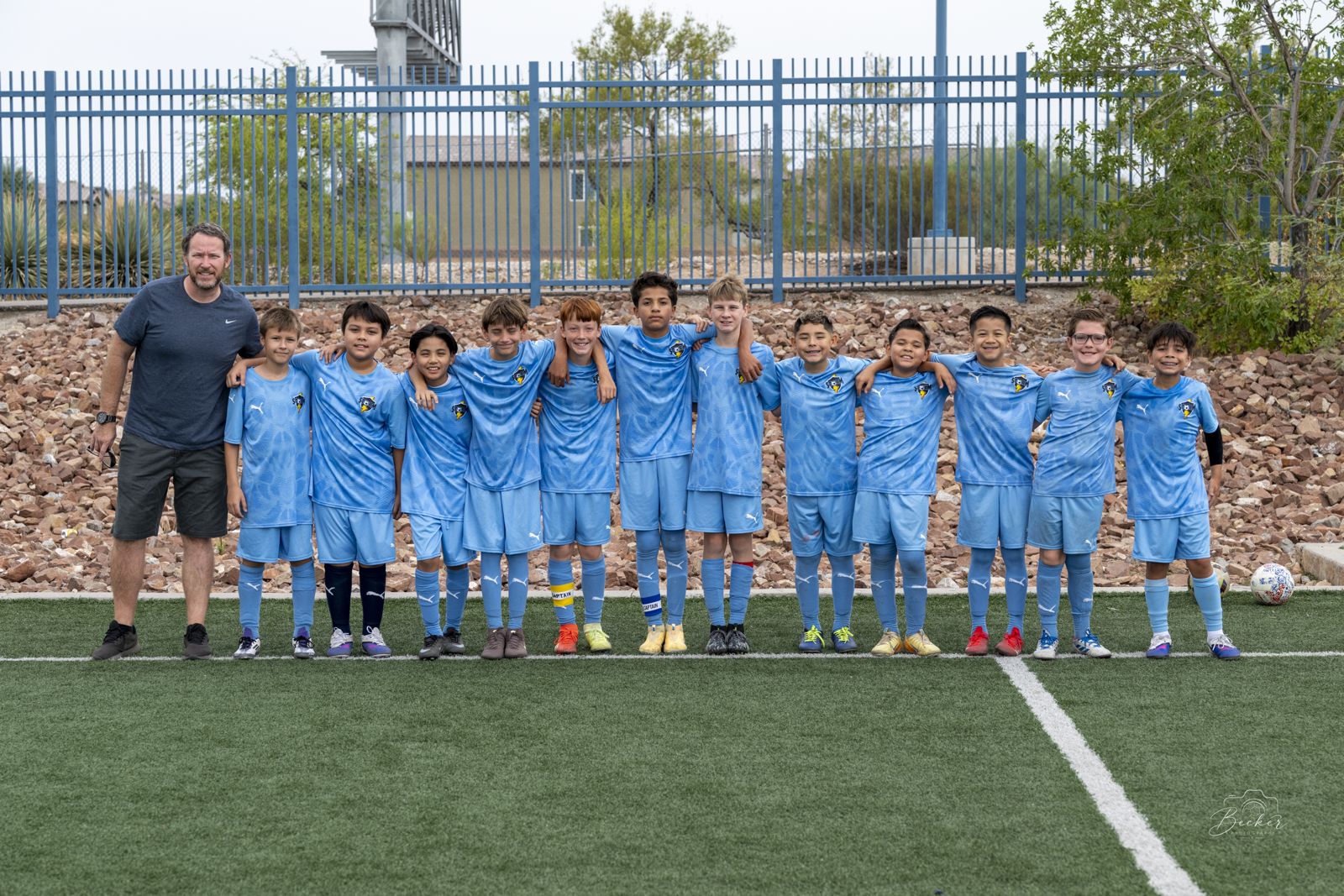 BU12 Academy team lineup with coach